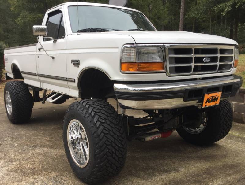 1996 Ford F350 with 9" Lift on 38x15.50R20 Fuel Gripper Tires and 20x14 Moto Metal MO401 Pollished Forged Wheels